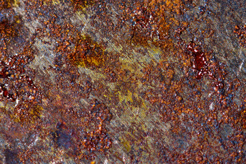 Macro photography of orange rust of rusty iron steel metal plate texture