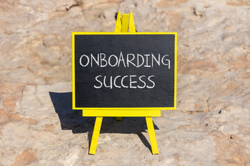 Onboarding success symbol. Concept words Onboarding success on black chalk blackboard on a beautiful stone background. Business onboarding success concept. Copy space.