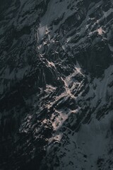 Aerial top view of snowy mountain peaks