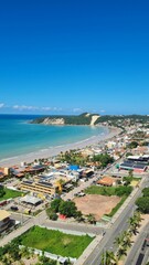 Fototapeta na wymiar Vertical drone shot of buildings on the Ponta Negra beach in Natal, Rio Grande do Norte, Brazil