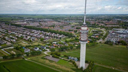 A Gerbrandy Tower next to a city and greenfield