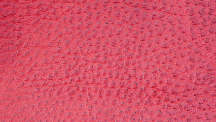 Red leather background with rough surface, texture