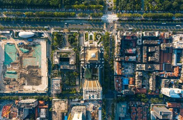 Aerial view of tall buildings in a city and lush green public park