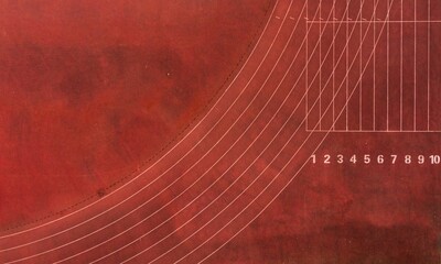 Aerial top view of a brown running track on a sunny day