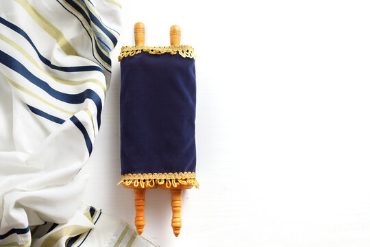 Torah scroll with Tallit on a light background