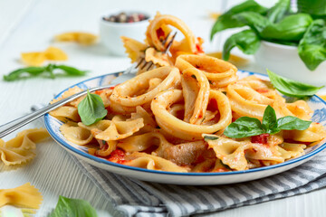 Pasta with calamari and tomato sauce.