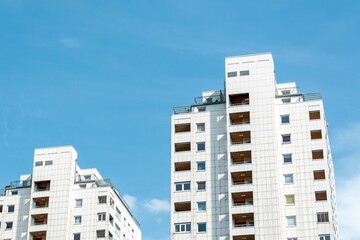 Low angle shot of residential towers in Vienna, Austria against a blue sky