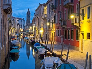 Fototapeta na wymiar Charming view of canal and traditional gondolas in Venice, Italy