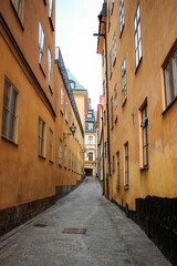 Vertical shot of a narrow street in a historic old town