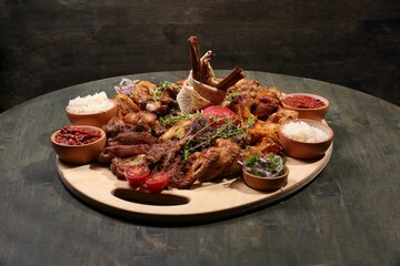Closeup shot of the roasted meat with rice and sauces