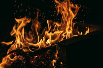 Closeup view of fire flames isolaated on a black background