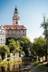 Vertical shot of the Cesky Krumlov Castle Tower by the river in Cesky Krumlov, Czechia