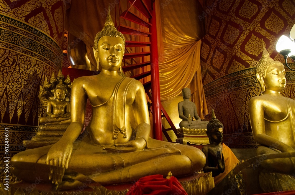 Poster golden buddhas inside the wat phanan choeng in ayutthaya, thailand