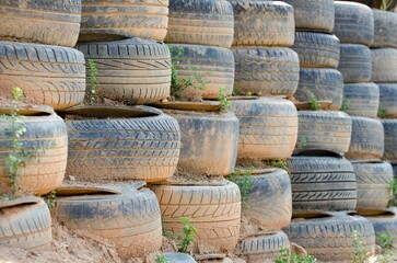 Pile of old, worn out tires serving as a retaining wall