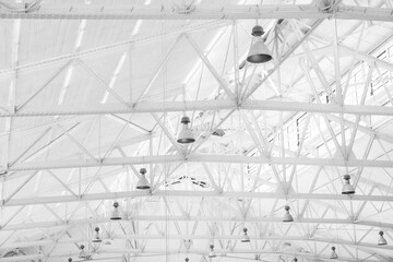 white hall, metal roof, lamps