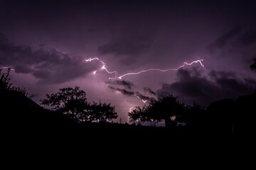 Mysterious view of a lightning in a purple night sky