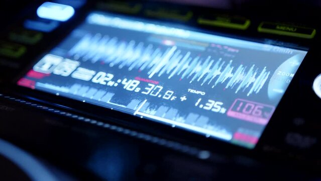 Closeup of a screen of a music mixing equipment for DJs in a club for a corporate party