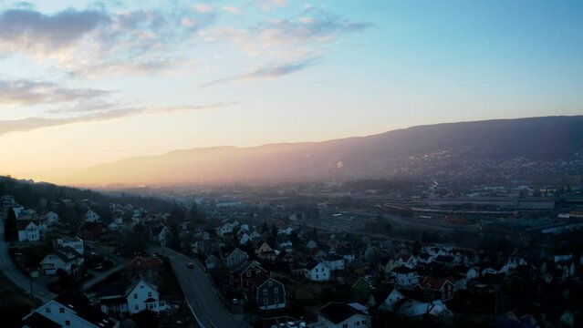 Aerial drone shot of Drammen in Norway in winter with cloudy sky in the background
