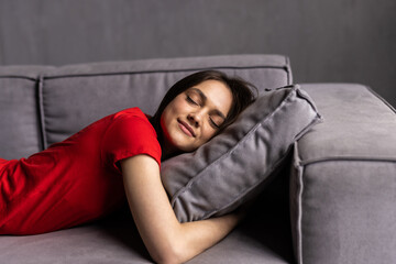 Obraz premium young woman sleeping on sofa