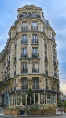 Fototapeta na wymiar Paris, ancient buildings avenue Daumesnil, typical facades and windows, with a bakery 