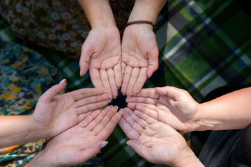 Hands young people close-up  meditating during yoga retreat