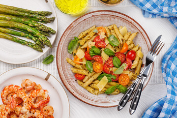 Italian pasta adorned with fresh tomatoes and aromatic basil