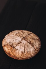 Baked bread in wooden background
