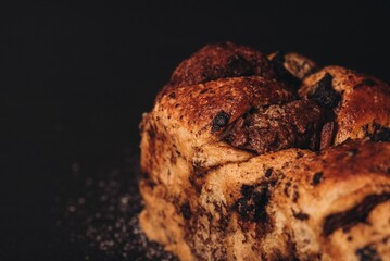 Freshly-baked loaf of bread served with a selection of delicious chocolate pieces