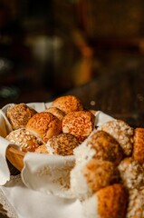 Vertical shot of wheat bread with poppy seeds and cereal wrapped in towels