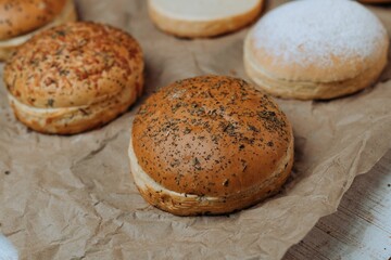 Closeup of freshly-baked buns arranged on a brown paper