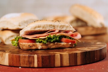 Sliced and freshly made sandwich put on the desk on the blurred background