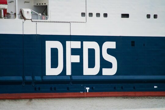 Logo of the Scandinavian ferry company DFDS is on the hull of the ship