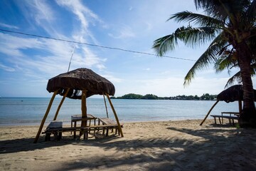 Small wooden gazebo on the coast of the sea in 1000 Islands national park, Philippines