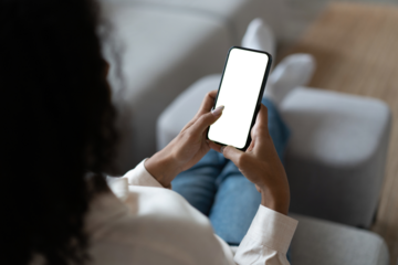 Young woman user customer hold smartphone mock up transparent screen in hand use mobile shopping app, check social media news