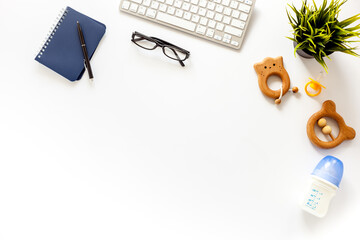 Multitasking mom working from home concept. Table with computer and kids toys