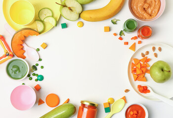 Frame made of healthy baby food, fresh, vegetables and dishware on white background