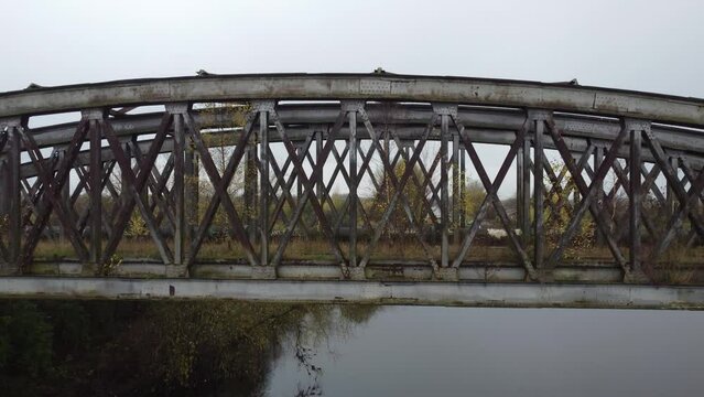 4k drone footage of derelict metal railway bridge