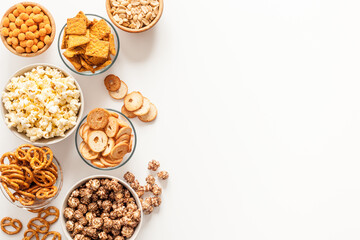 Many bowls of snacks for party - chips popcorn and nuts