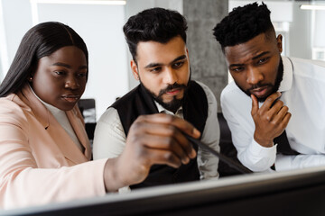 Young multiracial people in business suits working together at office
