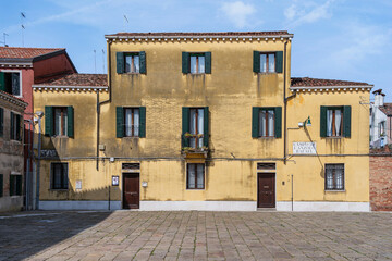 Old worn out building in Campo de L Anzolo Rafael in Venice, Italy