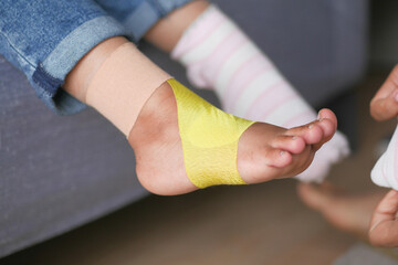 little child with plaster bandage on leg.