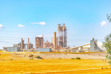 Zahana cement company plant. Industrial group of cement factories in Algeria. Smoke goes out of...