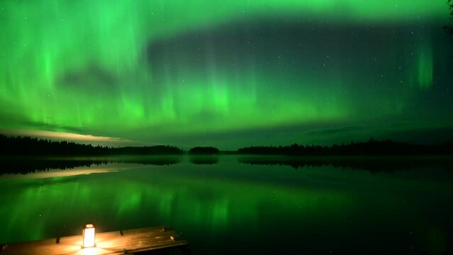 Timelapse of the glowing Northern Lights over a landscape in Rovaniemi, Lapland, Finland