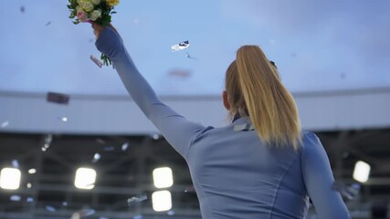 Young Female Athlete Celebrates a Win on a podium, receives a gold medal. Super slow motion, shot on RED cinema camera
