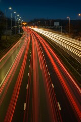 Fototapeta na wymiar Light trails from fast moving traffic on M42 motorway at night.