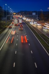 Fast moving traffic on the M42 passes through an active traffic management system during rush hour.