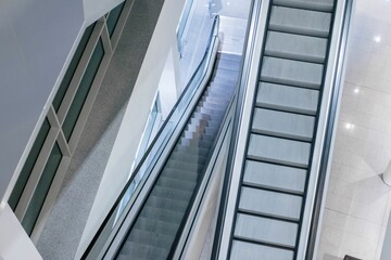 A horizontal shot from an escalator. Escalators are located and large stores and department stores