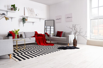 Interior of stylish living room with cozy sofas and coffee table