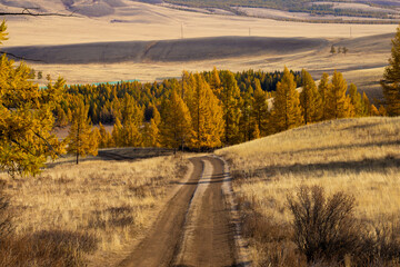 Fototapeta premium Autumn landscape with views of mountains, forest, rivers at sunrise and sunset