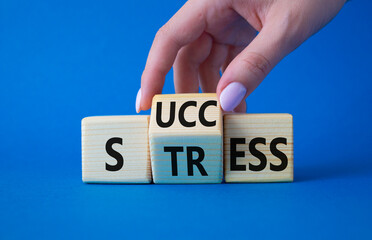 Success vs Stress symbol. Businessman hand turns wooden cubes and changes the word Stress to Success. Beautiful blue background. Business concept and Success vs Stress. Copy space